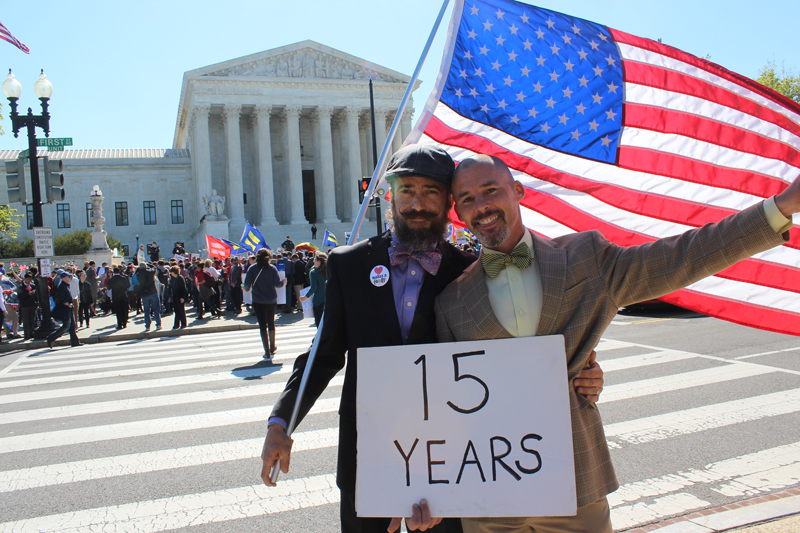 Joe Capley-Alfano, left, and Frank Capley-Alfano of Oakland, Calif., stand in front of the Supreme Court on April 28, 2015 as justices heard arguments about same-sex marriage. The couple have been together for 15 years and married in 2008 before Proposition 8 halted gay marriage in California until 2013. Religion News Service photo by Adelle M. Banks