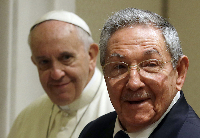 Cuban President Raul Castro, right, smiles as he meets Pope Francis during a private audience at the Vatican May 10, 2015. Photo courtesy of REUTERS/Gregorio Borgia/pool
