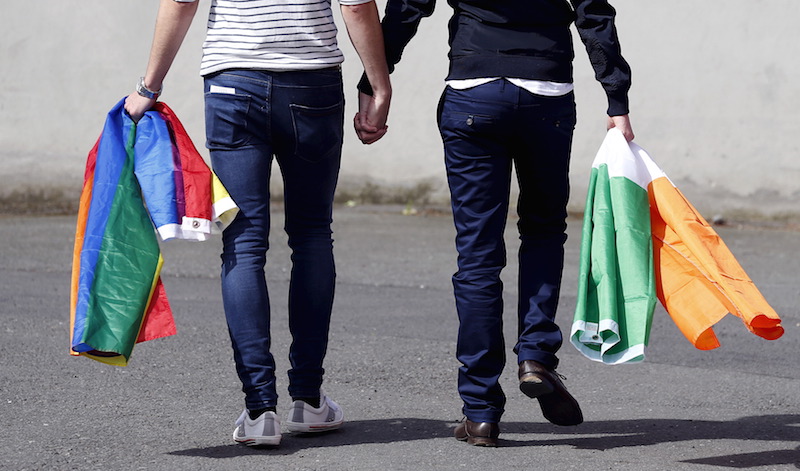 A couple walks hand in hand from the count centre in Dublin as Ireland holds a referendum on gay marriage May 23, 2015. REUTERS/Cathal McNaughton      