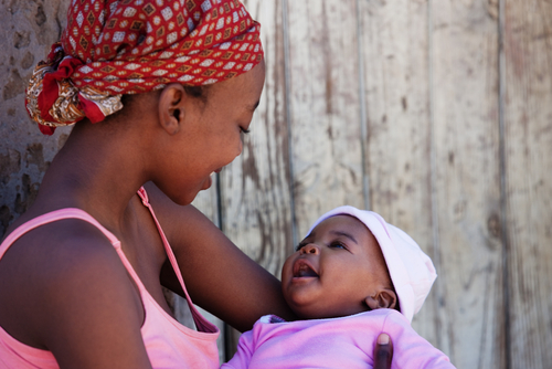 A mother holds her daughter in Mmankgodi village, Botswana.