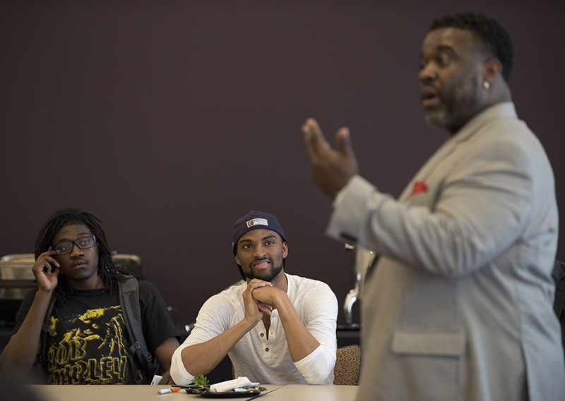 Freshman biology major Chris Porter III, left, and Brian Stewart, a senior business administration major and a member of the MSU LGBTQA Advisory Council, center, listen to Rev. Dr. Jamie Washington, far right, during a workshop after a screening of The New Black, a documentary that tells the story of how the African-American community is grappling with the gay rights issue in light of the recent gay marriage movement and the fight over civil rights, at Morgan State University in Baltimore on Wednesday, May 13, 2015. Religion News Service photo by Sait Serkan Gurbuz