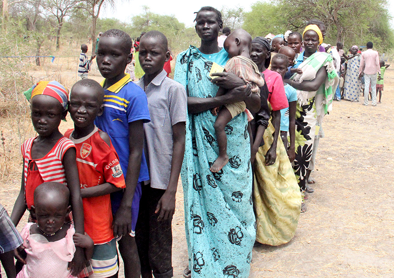 Residents displaced due to the recent fighting between government and rebel forces in the Upper Nile capital Malakal wait at a World Food Program (WFP) outpost where thousands have taken shelter in Kuernyang Payam, South Sudan, on May 2, 2015. Photo courtesy of REUTERS/Denis Dumo
*Editors: This photo may only be republished with RNS-SUDAN-VISION, originally transmitted on May 13, 2015. 