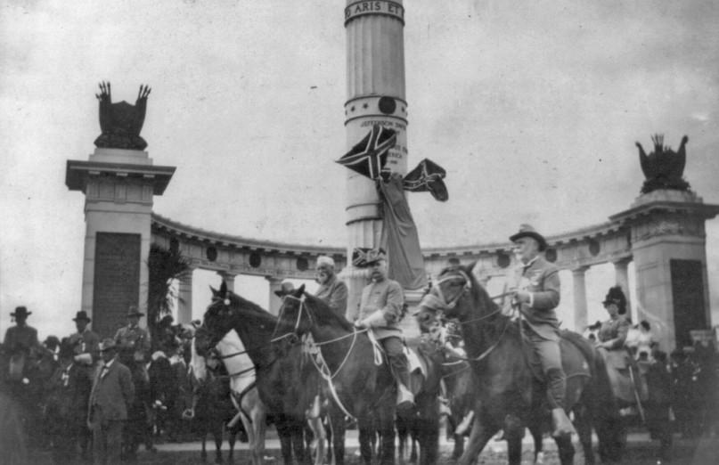 George Washington Custis Lee, 1832-1913, on horseback, with staff reviewing Confederate Reunion Parade in Richmond, Va., on June 3, 1907, in front of monument to Jefferson Davis.