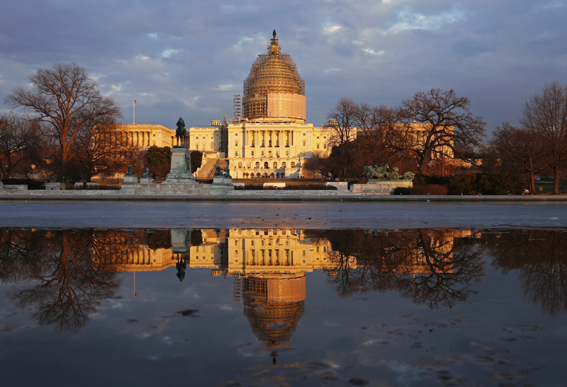Awash in the golden light of sunset, the U.S. Capitol casts its image upon the Reflecting Pool in Washington on January 20, 2015. Photo courtesy of REUTERS/Kevin Lamarque
*Editors: This photo may only be republished with RNS-BISHOPS-ENCYCLICAL, originally transmitted on June 18, 2015.