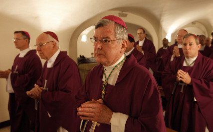 Archbishop John C. Nienstedt of St. Paul and Minneapolis, center, and other bishops from Minnesota, North Dakota and South Dakota concelebrate Mass at the Altar of the Tomb in the crypt of St. Peter's Basilica at the Vatican on March 9. Photo by Paul Haring, courtesy of Catholic News Service