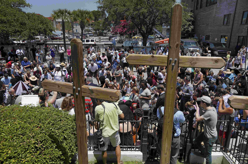 Mourners gather outside Morris Brown AME Church for a vigil the day after a mass shooting in Charleston, South Carolina on June 18, 2015. A 21-year-old white gunman accused of killing nine people at a historic African-American church in Charleston, South Carolina, was arrested on Thursday, said U.S. officials, who are investigating the attack as a hate crime. Photo courtesy of REUTERS/Brian Snyder
*Editors: This photo may only be republished with RNS-JUNETEENTH-CHARLESTON, originally transmitted on June 19, 2015.