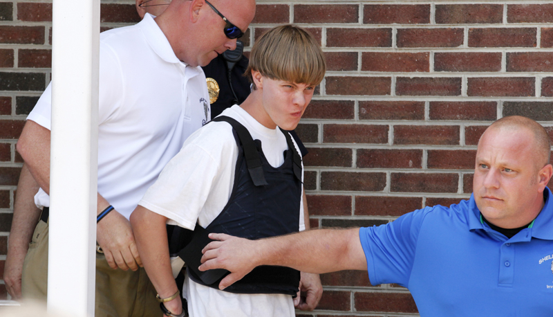 Police lead suspected shooter Dylann Roof, 21, into the courthouse in Shelby, North Carolina, on June 18, 2015.   Roof, a 21-year-old with a criminal record, is accused of killing nine people at a Bible-study meeting in a historic African-American church in Charleston, South Carolina, in an attack U.S. officials are investigating as a hate crime.  REUTERS/Jason Miczek
*Editors: This photo may only be republished with RNS-WAX-COMMENTARY, originally transmitted on June 19, 2015.