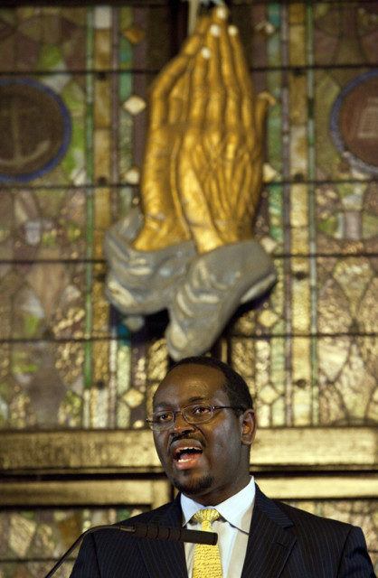 Senior Pastor, Rev. Clementa Pinckney, speaks to those gathered during the Watch Night service at Emanuel African Methodist Episcopal Church in Charleston, South Carolina on December 31, 2012.  Photo courtesy of REUTERS/Randall Hill  