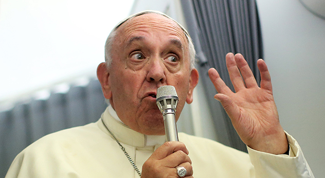 Pope Francis said he would be opening his ears -- and presumably his mind -- to hear his American critics. Here are two places he should start.
(Photo: Pope Francis speaks to journalists onboard the papal plane during his return to Rome, from Asuncion, Paraguay on July 12, 2015. Courtesy of REUTERS/Alessandro Bianchi)