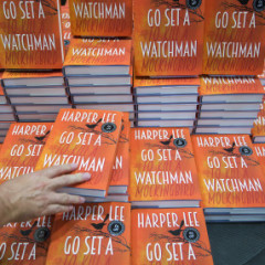 A customer picks up a copy of author Harper Lee's novel "Go Set a Watchman" at a Waterstones bookstore in London, Britain on July 14, 2015. "Go Set a Watchman" is the much-anticipated second novel by "To Kill a Mockingbird" author Harper Lee. Photo courtesy of REUTERS/Neil Hall