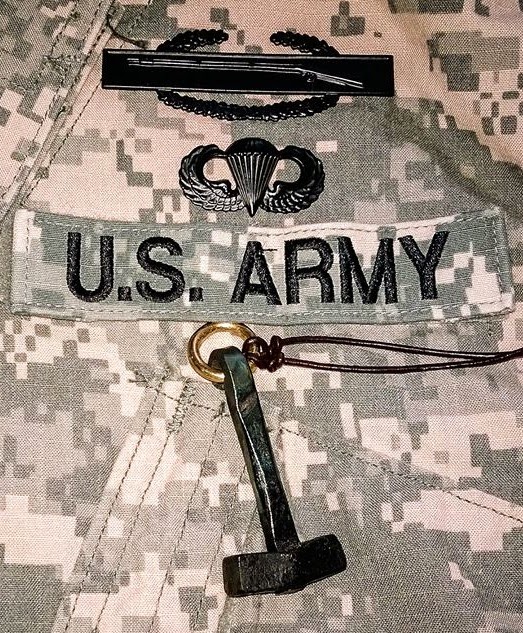 US Army insignia and the Hammer of Thor. Photo courtesy of Karl E. H. Seigfried