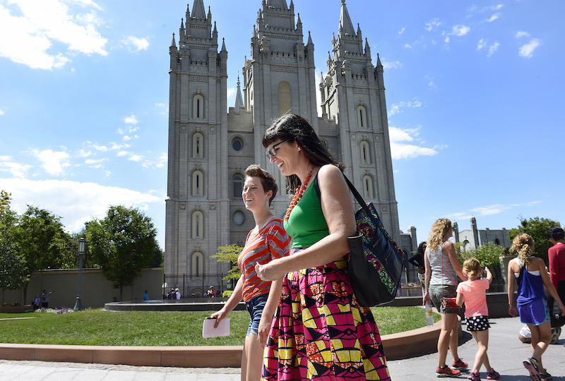 Kate Kelly, foreground, who later spoke on " Finding Joy in Authenticity" marches past the Salt Lake LDS temple along with others on their way to deliver resignation letters to the Church office building. Prominent dissident Mormons held a rally and mass resignation from the LDS Church, Saturday, July 25, 2015. Photo courtesy Scott Sommerdorf , The Salt Lake Tribune
