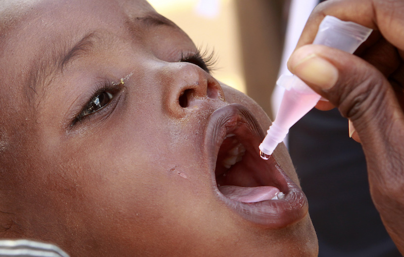 A newly arrived Somali refugee child receives a polio drop at the Ifo extension refugee camp near the Kenya-Somalia border, August 1, 2011. Photo couresy REUTERS/Thomas Mukoya 