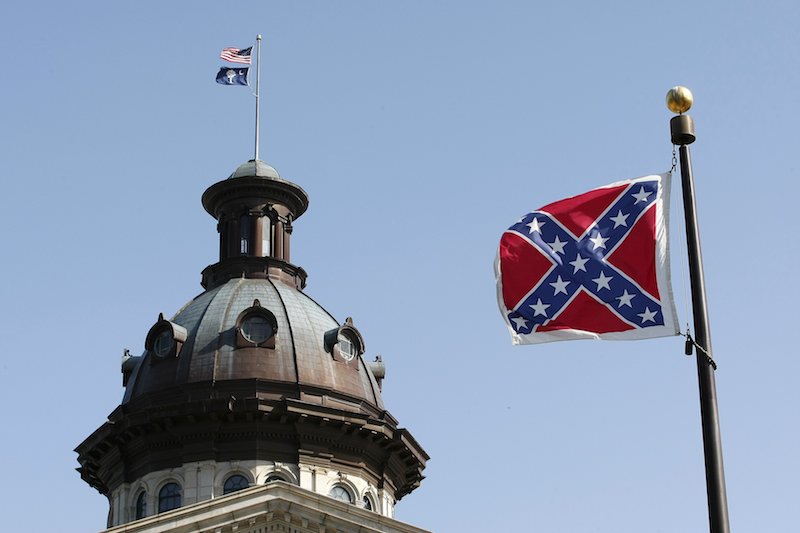 A Confederate flag flies at the base of a Confederate memorial in front of the South Carolina Statehouse in Columbia on July 4, 2015.  Photo by Tami Chappell, courtesy of Reuters
*Editors: This photo may only be republished with RNS-GAY-OPED, originally transmitted on June 8, 2016.