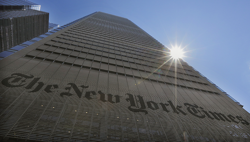 The sun peeks over the New York Times Building in New York on August 14, 2013. Photo courtesy of REUTERS/Brendan McDermid 
*Editors: This photo may only be republished with RNS-MERRITT-COLUMN, originally transmitted on July 23, 2015.