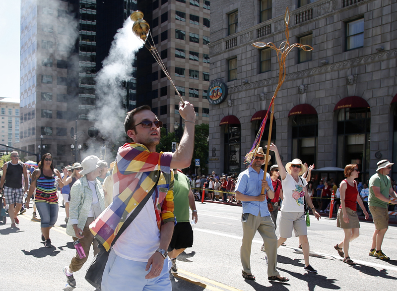 Charlie Knuth, front left, of the All Saints Episcopal Church swings a censer as he marches in a gay pride parade in Salt Lake City, Utah, on June 2, 2013. Photo courtesy of REUTERS/Jim Urquhart  *Editors: This photo may only be republished with RNS-EPISCOPAL-SPLAINER, originally transmitted on July 2, 2015.