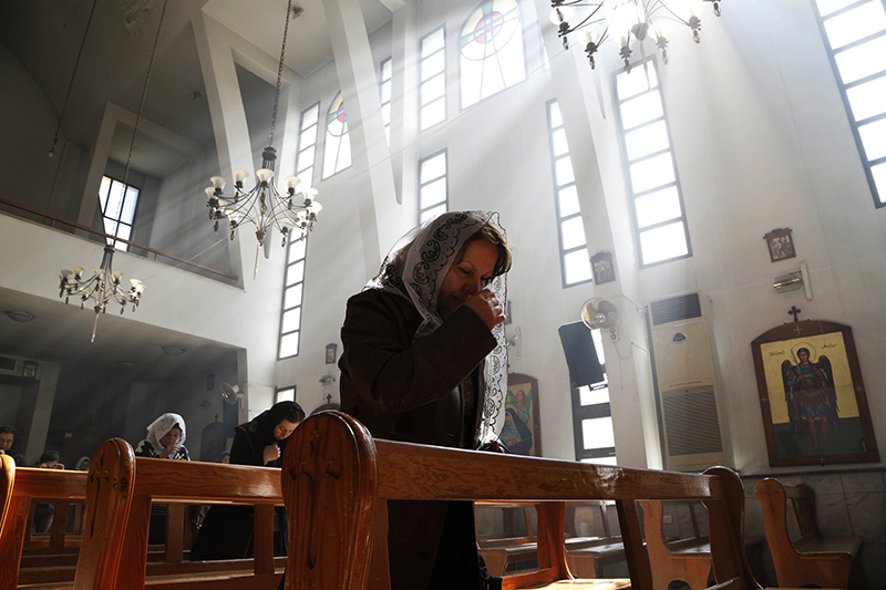 An Assyrian woman attends a mass in solidarity with the Assyrians abducted by Islamic State fighters in Syria earlier this week, inside Ibrahim al-Khalil church in Jaramana, eastern Damascus on March 1, 2015. Photo courtesy of REUTERS/Omar Sanadiki 
*Editors: This photo may only be republished with RNS-SEIPLE-COLUMN, originally transmitted on July 7, 2015.