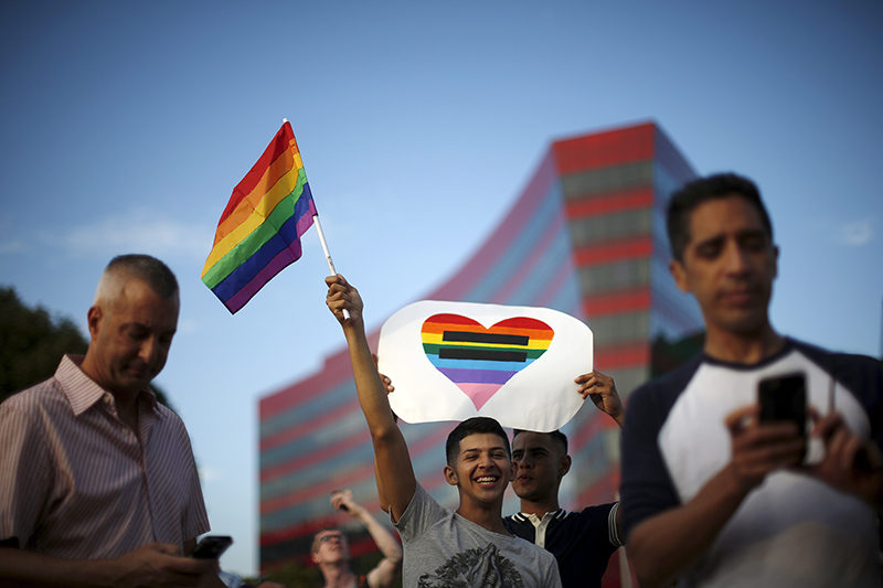 Anthony Tielemans, 17, center left, and Paul Chavez, 27, center right, celebrate at a rally in West Hollywood, California, United States, on June 26, 2015. Photo courtesy of REUTERS/Lucy Nicholson
*Editors: This photo may only be republished with RNS-KRATTENMAKER-COLUMN, originally transmitted on August 18, 2015.