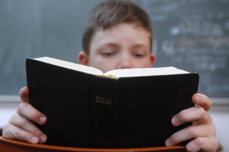 A boy from the Mennonite community reads the bible at his school in Cuauhtemoc, Mexico o November 8, 2012. Photo courtesy of REUTERS/Jose Luis Gonzalez 
*Editors: This photo may only be republished with RNS-WAX-COLUMN, originally transmitted on August 17, 2015.