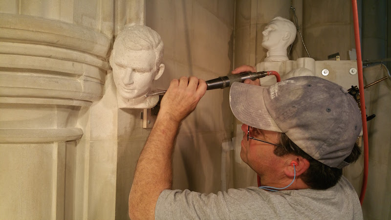 Stone carver Sean Callahan works on a bust of Jonathan Daniels at the Washington National Cathedral. Photo courtesy Kevin Eckstrom, Washington National Cathedral