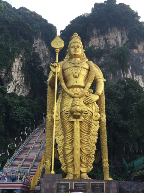 A golden statue of Lord Murugan -- 140 feet high -- marks the entrance to the Batu Caves