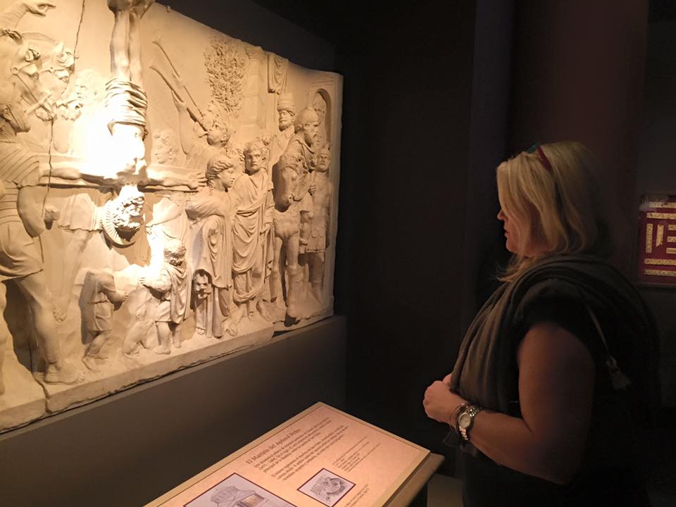 Jennifer Ruggio examines a piece of art at the Franklin Institute's exhibition, Vatican Splendors. Religion News Service photo by Anne Marie Hankins