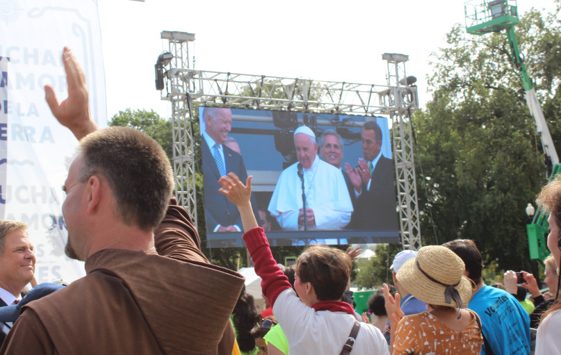 People attending the Rally for Moral Action for Climate Change wave to Pope Francis as he greets crowds outside the U.S. Capitol in Washington on Sept. 24, 2015. Religion News Service photo by Adelle M. Banks