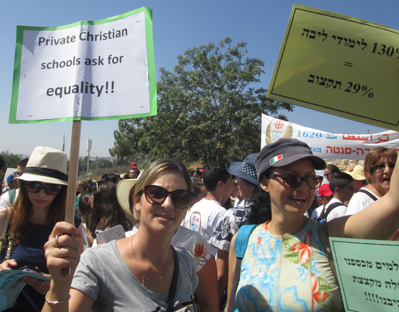 An ongoing strike over reduced government funding to Israel's 47 Christian schools has kept 33,000 Christian and Muslim students home for a week. Teachers, students and parents held a rally outside the Prime Minister's Office in Jerusalem on September 6, 2015. Religion News Service photo by Michele Chabin
