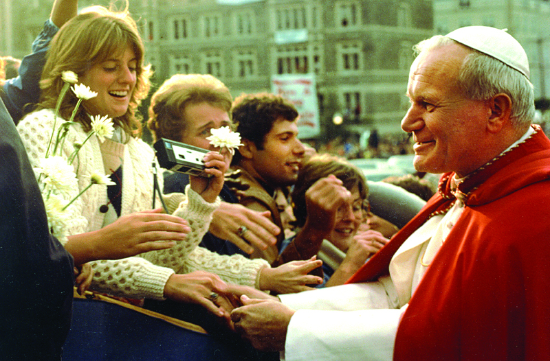 In 1979, Cardinal William Baum hosted Pope John Paul II's visit to the nation's capital. Pictured here, Pope John Paul II greets students at The Catholic University of America. Photo courtesy of the Catholic Standard, newspaper of the Archdiocese of Washington