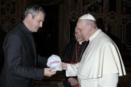 The Rev. Andrew Small, national director of the Pontifical Mission Societies in the United States, left, greets Pope Francis. Photo courtesy of the Pontifical Mission Societies in the United States