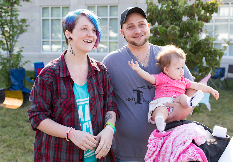 Camryn Colen, right, who is transgender, and his wife Alexis and daughter Lakoda, attended a marriage equality rally held outside the Rowan County Courthouse, on Saturday, Aug. 29, 2015 in Morehead. The rally was to protest the decision by County Clerk Kim Davis to suspend issuing marriage licenses. Alexis who identifies as pan sexual, said Davis’ office provided the license on Feb. 26 without asking to see Camryn’s birth certificate, which still identifies him as female. The couple married that night. “She saw just a straight couple in love, and she should see everybody like that,” Camryn said. “She shouldn’t just see straight couples like that.” Photo by Jonathan Palmer/Special for The (Louisville, Ky.) Courier-Journal, courtesy of USA Today