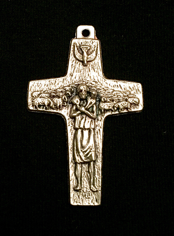 A metal cross that sells for $1.95 in the St. John Neumann Shrine gift shop, in Philadelphia measures 1.5 inches long by 1 inch wide. Religion News Service photo by Leslie Miller