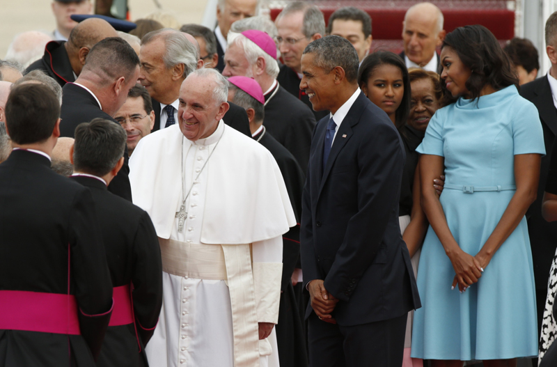 U.S. President Barack Obama welcomes Pope Francis to the United States as the Pontiff shakes hands with dignitaries upon his arrival at Joint Base Andrews outside Washington on September 22, 2015. REUTERS/Kevin Lamarque *Editors: This photo may only be republished with RNS-POPE-ARRIVAL, originally transmitted on September 22, 2015.