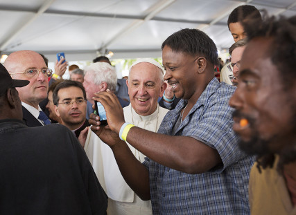 Pope Francis visits with homeless who are served meals by Catholic charities, in Washington, DC, on September 24, 2015. Photo courtesy of REUTERS/Pool *Editors: This photo may only be republished with RNS-POPE-HOMELESS, originally transmitted on Sept. 24, 2015.