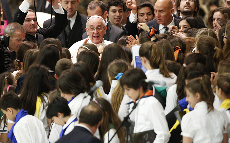 Pope Francis is surrounded by children during a special audience with students of Jesuit schools in Paul VI hall at the Vatican on June 7, 2013. Photo courtesy of REUTERS/Max Rossi
*Editors: This photo may only be republished with RNS-POPE-JESUIT, originally transmitted on September 15, 2015.