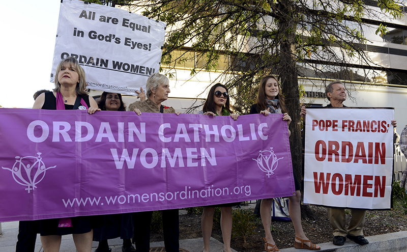 Demonstrators calling for the Catholic Church to include women priests gather prior to the arrival of Pope Francis at the Cathedral of St. Matthew the Apostle, for a prayer service and meeting with U.S. bishops, in Washington, on September 23, 2015. This is the first visit ever to the U.S by the pontiff. Photo courtesy of REUTERS/Mike Theiler *Editors: This photo may only be republished with RNS-POPE-PHILLY, originally transmitted on Sept. 26, 2015.