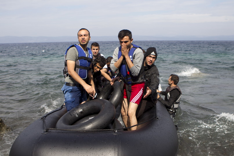 Afghan refugees arrive on a dinghy on the Greek island of Lesbos, after crossing a part of the Aegean Sea from the Turkish coast, on Oct. 8, 2015. Refugee and migrant arrivals to Greece this year will soon reach 400,000, according to the UN Refugee Agency. Photo courtesy REUTERS/Dimitris Michalakis