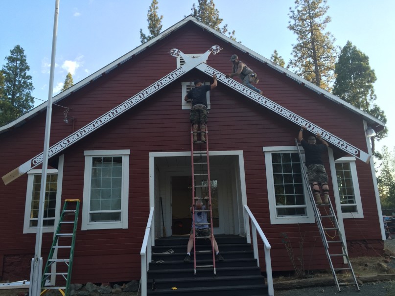 Members of Asatru Folk Assembly raise carved beams with crossed horse heads and Norse runes on their new meeting hall in Northern California. Photo courtesy of Bradley Taylor-Hicks
