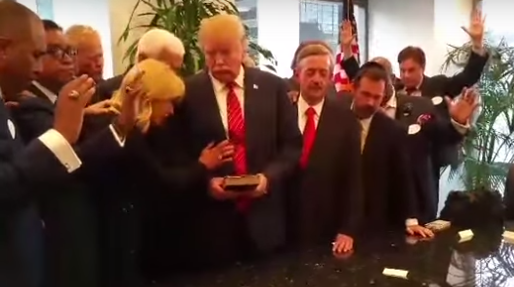 Evangelical pastors lay hands on Donald Trump and pray for him. Screenshot from video 
