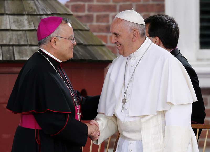 Pope Francis shakes hands with Archbishop Charles Chaput as he arrives on the Independence Mall to deliver remarks on the theme "We Hold These Truths," a quote from the Declaration of Independence, in front of Independence Hall in Philadelphia, on September 26 2015. Photo courtesy of REUTERS/Jonathan Ernst *Editors: This photo may only be republished with RNS-CHAPUT-SYNOD, originally transmitted on Oct. 7, 2015.