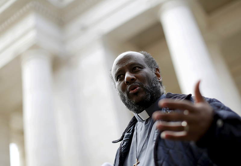 Eritrean priest Mussie Zerai gestures during an interview in front of Saint Peter's Square at the Vatican on September 30, 2015. Zerai, who has helped some of the thousands of African migrants who have risked their lives to cross the Mediterranean sea, is among the nominees for the Nobel Peace Prize. Photo courtesy of REUTERS/Alessandro Bianchi
*Editors: This photo may only be republished with RNS-ERITREA-PRIEST, originally transmitted on Oct. 13, 2015.