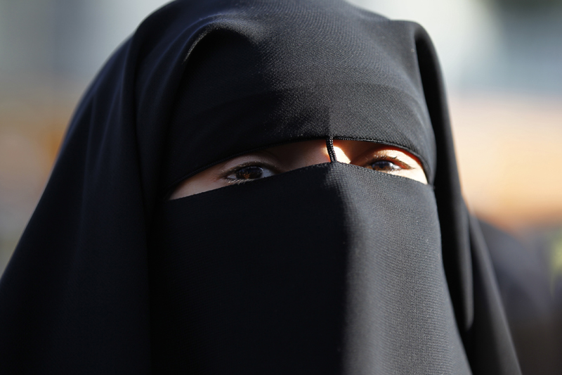 Hind Ahmas wears a niqab despite a nationwide ban on the Islamic face veil outside the courts where she arrived with the intention to pay a fine after she was arrested last May for wearing the niqab in public, in Meaux, east of Paris, on September 22, 2011. Photo courtesy of REUTERS/Charles Platiau *Editors: This photo may only be republished with RNS-FRANCE-NIQAB, originally transmitted on Oct. 20, 2015.