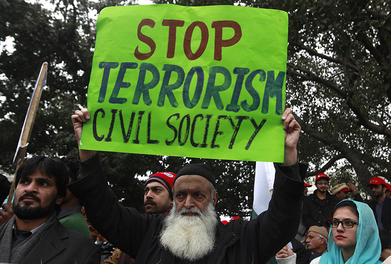 A man holds an anti-Taliban sign along with others during a peace rally in Lahore on January 5, 2015. Photo courtesy of REUTERS/Mohsin 
*Editors: This photo may only be republished with RNS-FREEDOM-REPORT, originally transmitted on Oct. 14, 2015.