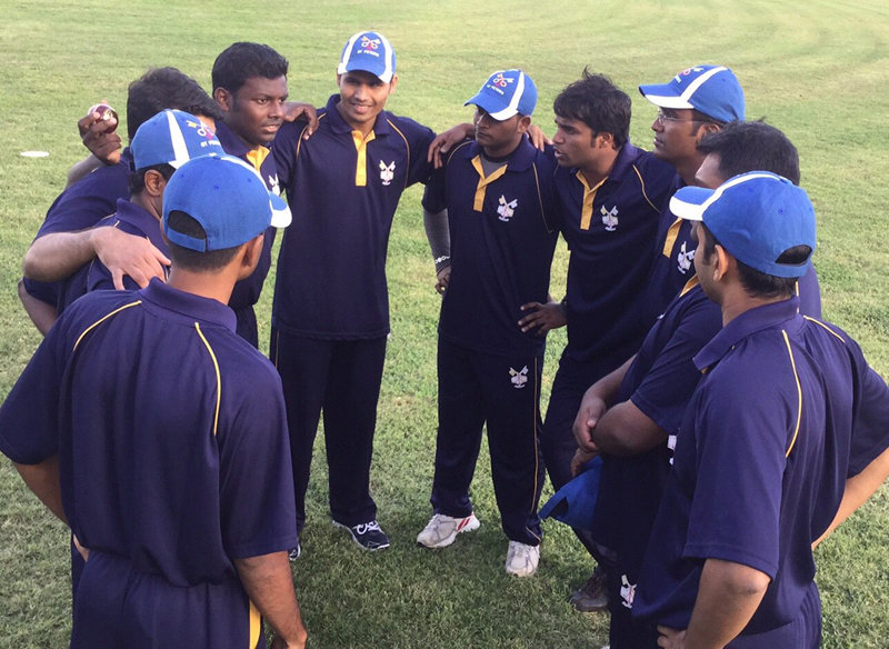 The St. Peter's Cricket Club huddles during their match against London’s Highgate Taverners, on Oct. 2, 2015 in Rome's Aqueduct Park. Photo courtesy of St. Peter's Cricket Club