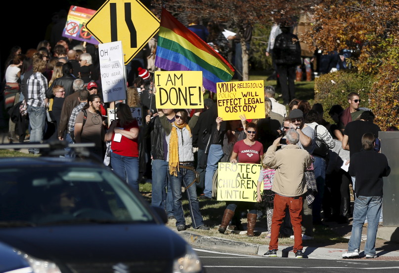 Members of The Church of Jesus Christ of Latter-day Saints and their supporters gather to resign their membership to the church in Salt Lake City, Utah November 14, 2015. Hundreds of Mormons are expected to mail letters resigning from the faith after gathering in Salt Lake City on Saturday to protest a new church policy that calls married same-sex couples apostates and bars their children from baptism. Photo courtesy of REUTERS/Jim Urquhart.
