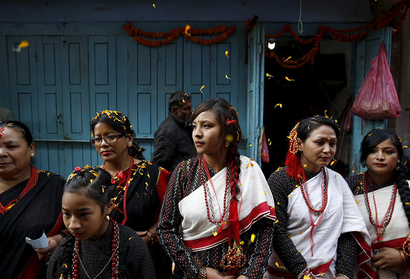 Participants from the Newar community in traditional attire take part in the parade to celebrate the Newari New Year that falls during the Tihar festival, also called Diwali, in Kathmandu, Nepal, on Nov. 12, 2015. Members of the Newar community observe the start of their Newari New Year 1136, in accordance with their lunar calendar, by worshipping their spiritual selves in a ritual known as 
