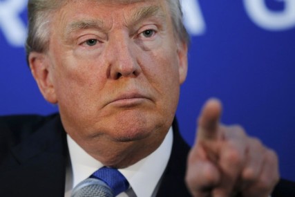 U.S. Republican presidential candidate Donald Trump gestures as he answers a question. Photo by Brian Snyder courtesy of Reuters  