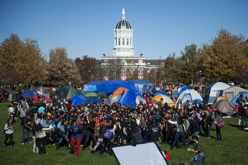 Supporters of Concerned Student 1950 celebrate following UM President Tim Wolfe's resignation announcement on Nov. 9, 2015 at the protest movement's camp area on Carnahan Quadrangle at the University of Missouri. Photo by Nick Schnelle