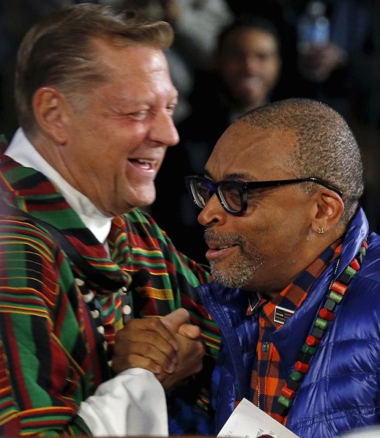 Director Spike Lee (R) is greeted by Father Michael Pfleger during a mass at Saint Sabina Church in Chicago, Illinois, United States, November 22, 2015. A character in Spike Lee's new movie 