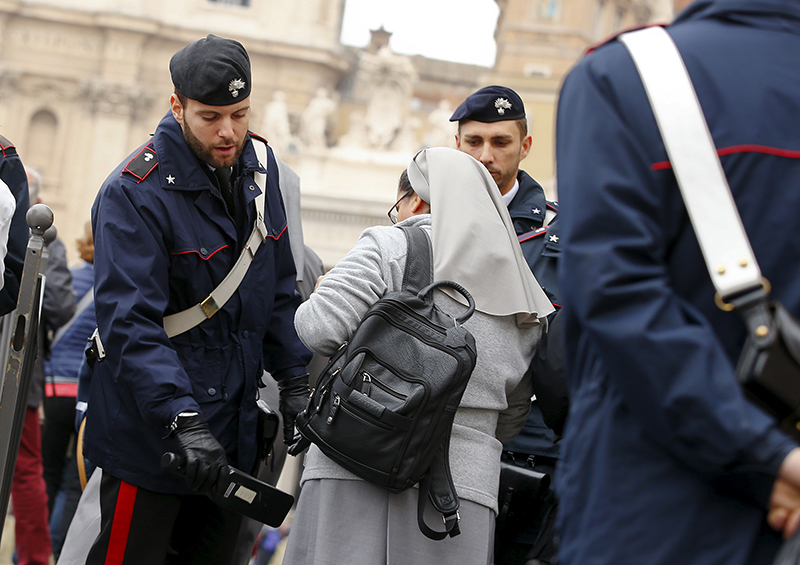Italian Carabinieri officers check a nun as she arrives to attend Pope Francis' Wednesday general audience in Saint Peter's square at the Vatican on November 18, 2015. Photo courtesy of REUTERS/Tony Gentile
*Editors: This photo may only be republished with RNS-VATICAN-SECURITY, originally published on Nov. 19, 2015.